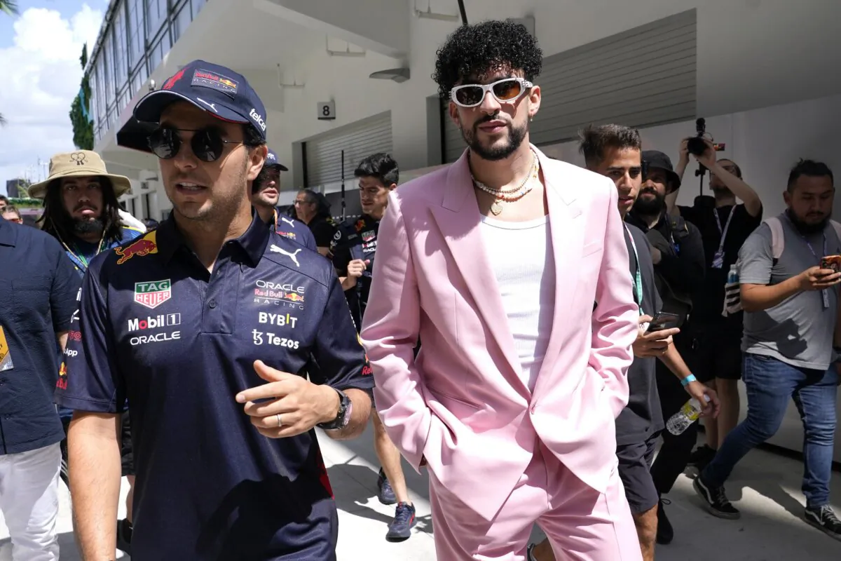 Red Bull driver Sergio Perez, of Mexico (L), walks with Puerto Rican reggaeton musician Bad Bunny before a Formula One Miami Grand Prix auto race at Miami International Autodrome in Miami Gardens, Fla., on May 8, 2022. (Lynne Sladky/AP Photo)