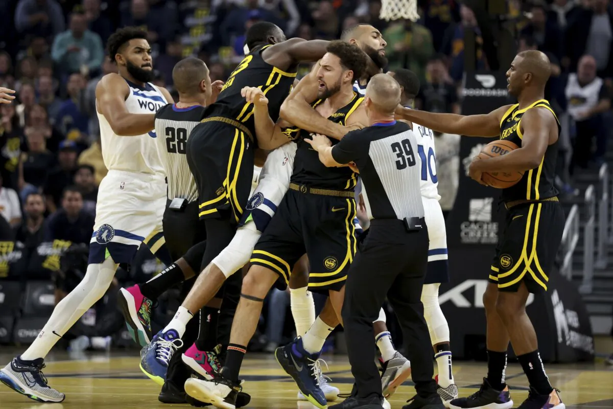 Golden State Warriors guard Klay Thompson, front, Draymond Green (L) gets into an altercation with Minnesota Timberwolves center Rudy Gobert, back, during the first half of an in-season NBA tournament basketball game in San Francisco on Nov. 14, 2023. (Jed Jacobsohn/AP Photo)