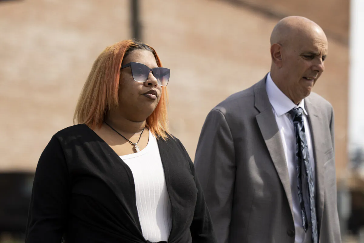 Deja Taylor (L) arrives to the United States Courthouse in Newport News, Va., on Sept. 21, 2023, with her lawyer James Ellenson. (Billy Schuerman/The Virginian-Pilot via AP)
