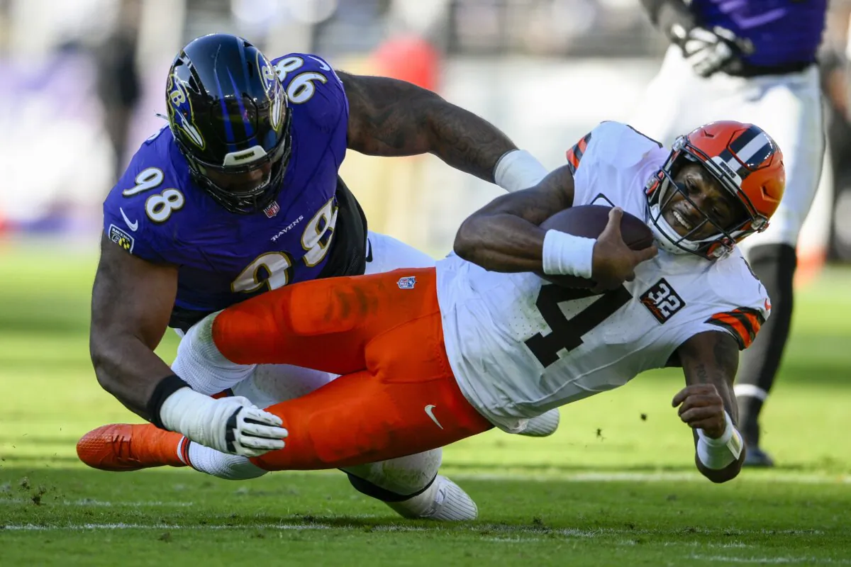 Cleveland Browns quarterback Deshaun Watson is tackled by Baltimore Ravens defensive tackle Travis Jones during the first half on an NFL football game in Baltimore on Nov. 12, 2023. (Nick Wass/AP Photo)