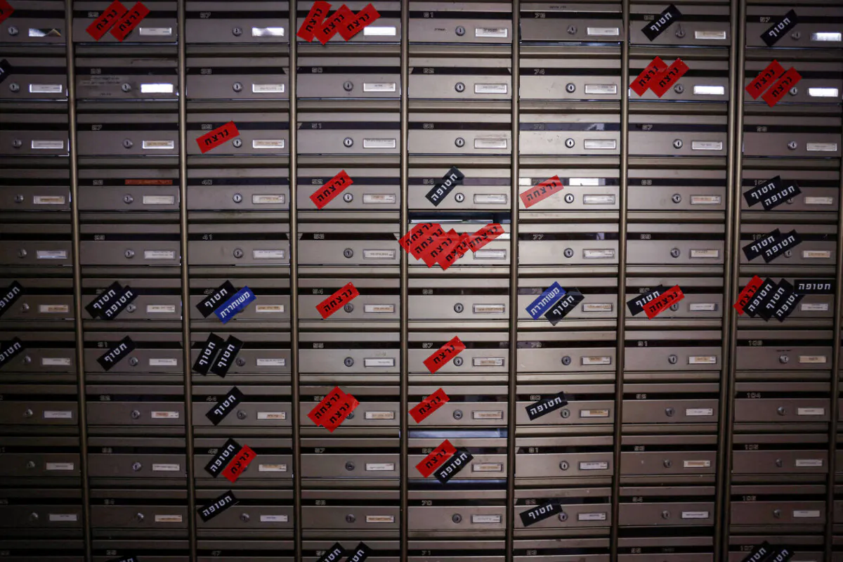 A picture taken on Nov. 14, 2023 shows mailboxes of kibbutz Nir Oz in southern Israel, which bear the names of residents who went missing, were kidnapped or killed during the Oct. 7 attack my Hamas militants. (Kenzo Tribouillard/AFP via Getty Images)