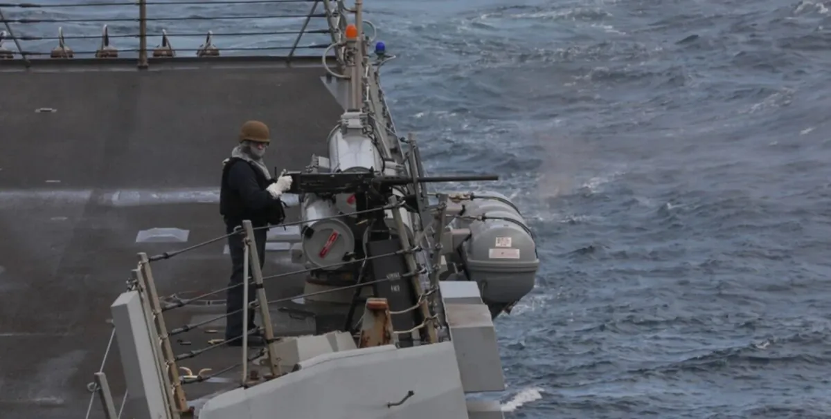 Sailors on board the Arleigh Burke-class guided-missile destroyer USS Thomas Hudner (DDG-116) conduct a test of its .50-caliber machine guns in the Atlantic Ocean on March 4, 2023. (Kerri Kline/U.S. Navy)