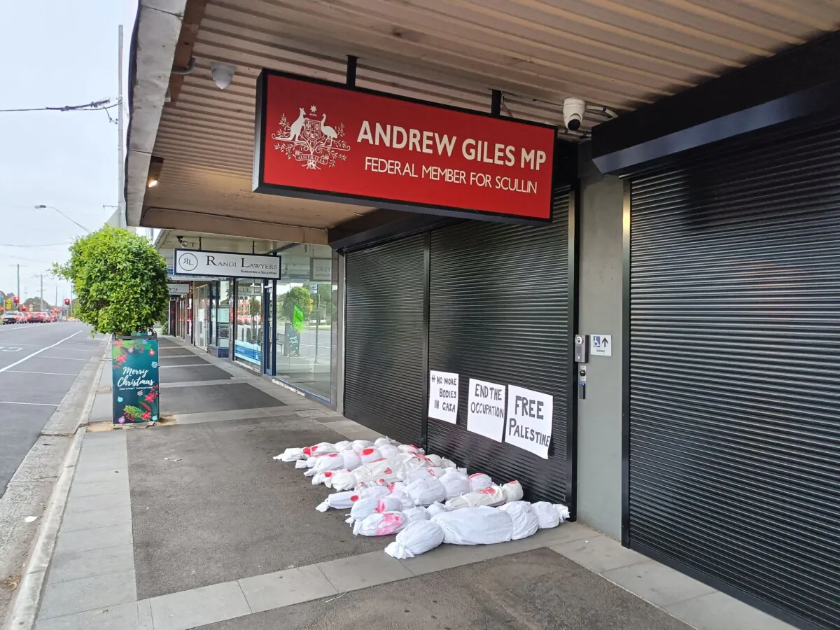 Fake corpses placed outside the office of Immigration Minister Andrew Giles in Melbourne, Australia, on Nov. 15, 2023. (Courtesy of No More Bodies In Gaza)