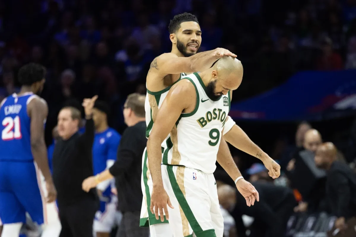Boston Celtics forward Jayson Tatum (0) congratulates guard Derrick White (9) after his three pointer against the Philadelphia 76ers during the fourth quarter at Wells Fargo Center in Philadelphia on Nov. 15, 2023. (Bill Streicher/USA TODAY Sports via Field Level Media)
