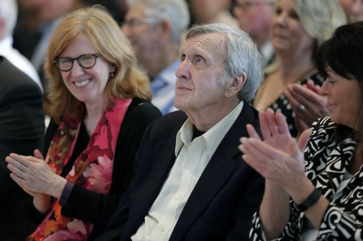 Ken Squier watches a video after being named as a member of the class of 2018 during an announcement at the NASCAR Hall of Fame in Charlotte, N.C., on May 24, 2017. (Chuck Burton/AP Photo)