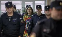 Russian Artist Who Staged Anti-War Protest in Supermarket Jailed for 7 Years