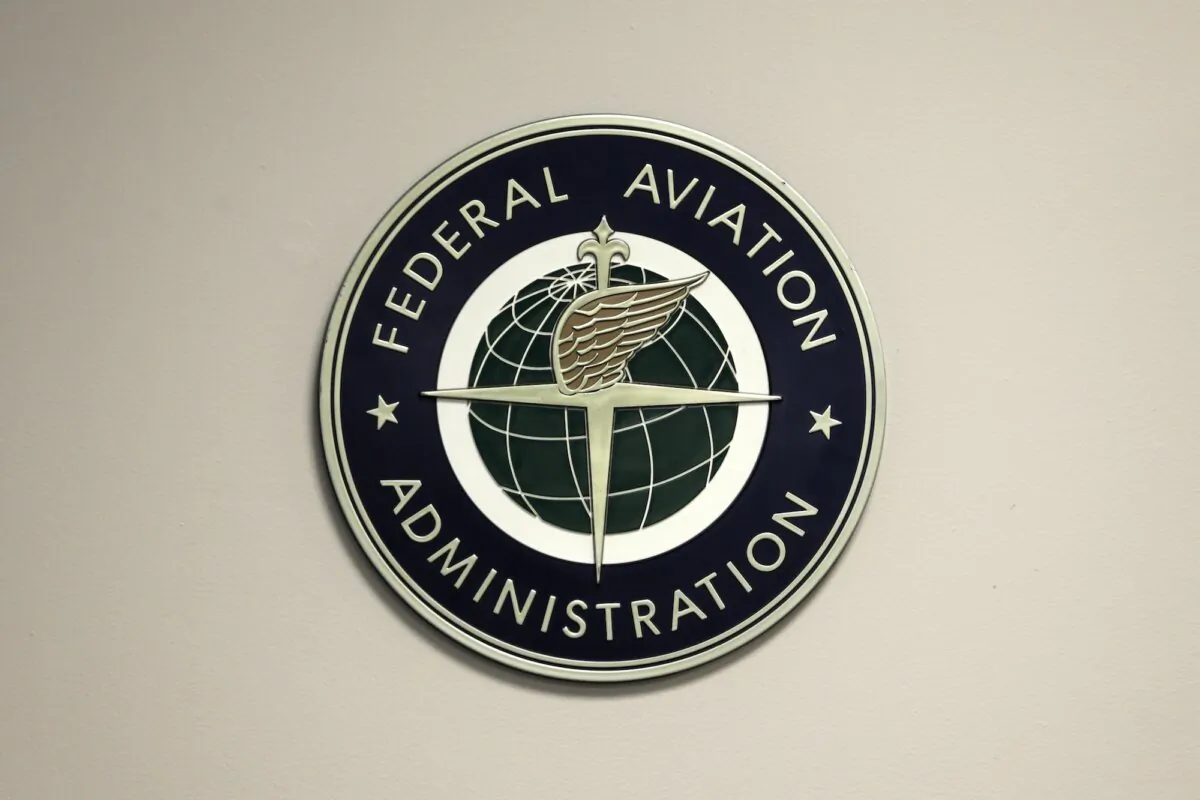 A Federal Aviation Administration sign hangs in the tower at John F. Kennedy International Airport in New York, on March 16, 2017. (Seth Wenig, File/AP Photo)