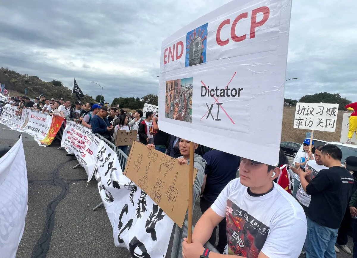 People demonstrate against Chinese leader Xi Jinping as he meets with U.S. President Joe Biden during the Asia-Pacific Economic Cooperation (APEC) Leaders' Week, in Woodside, Calif., on Nov. 15, 2023. (Gilles Clarenne/AFP via Getty Images)