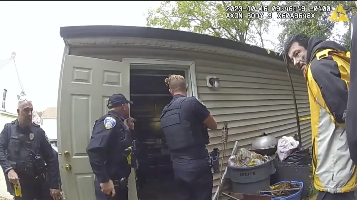 Police take William Mozingo into custody while searching his garage in Kenmore, Ohio on Oct. 16, 2023. (Akron Police via AP)