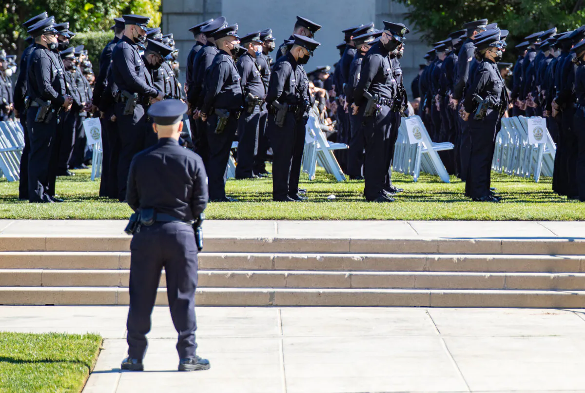 Los Angeles Police Department (LAPD) officers gather for the funeral service of a police officer in a file photo. (John Fredricks/The Epoch Times)