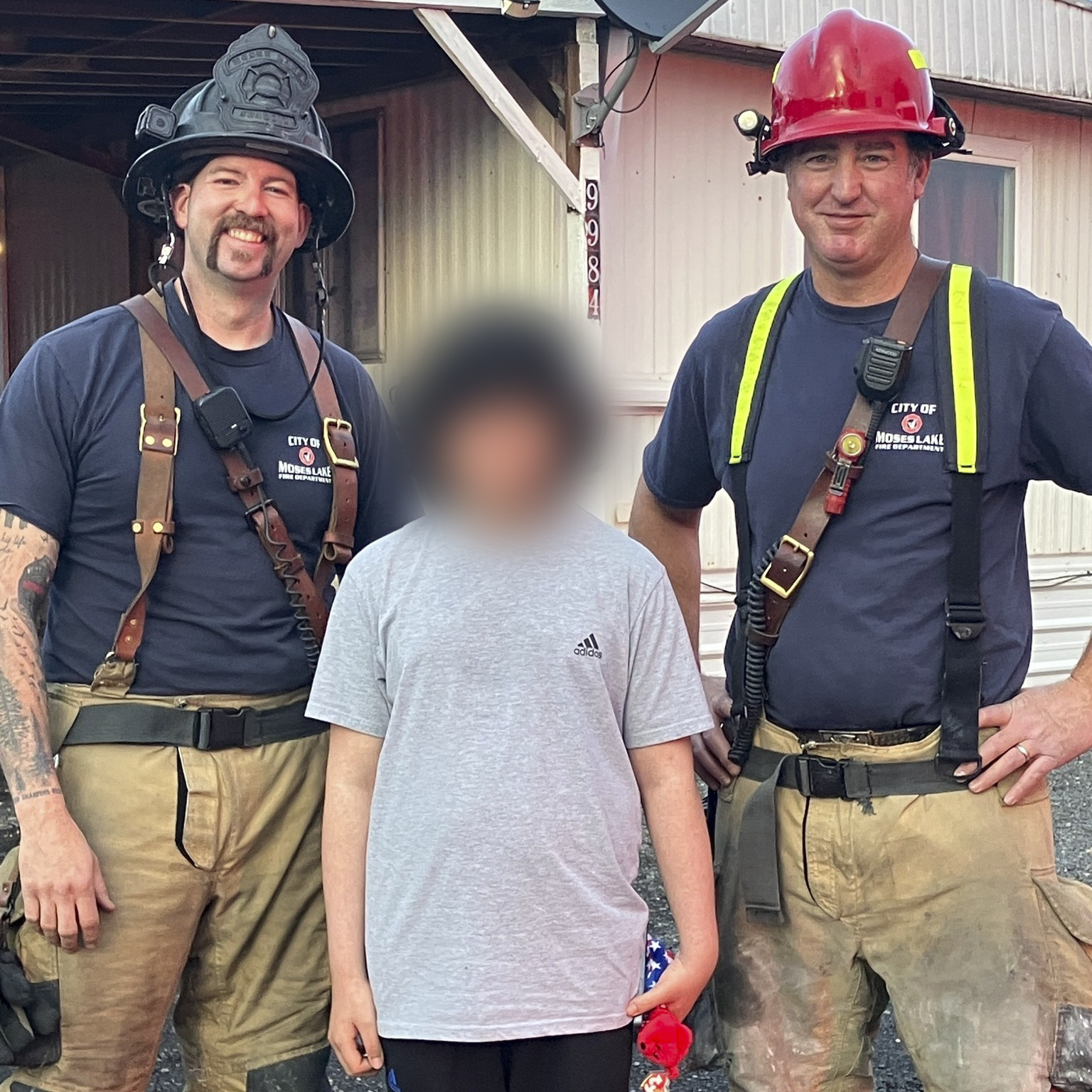 Isaac Rodriguez (middle) with Moses Lake firefighters.