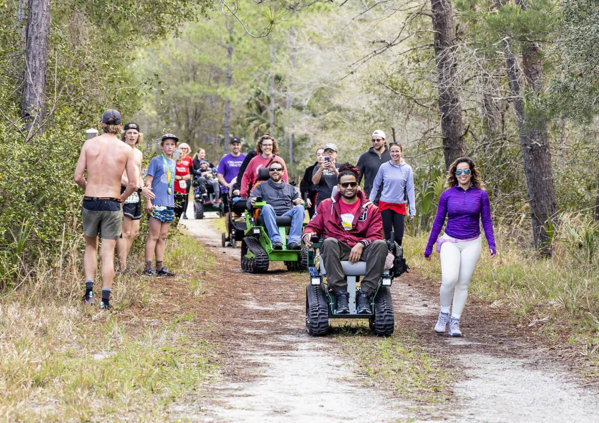 Tracked chair participants near the finish line during Friends of Seminole State Forest’s Run for the Woods on Sunday, Feb. 12, 2023. The tracked chair program is open for the public to reserve a chair to use on the forest’s trails on Saturdays and Sundays. (Patrick Connolly/Orlando Sentinel/TNS)  