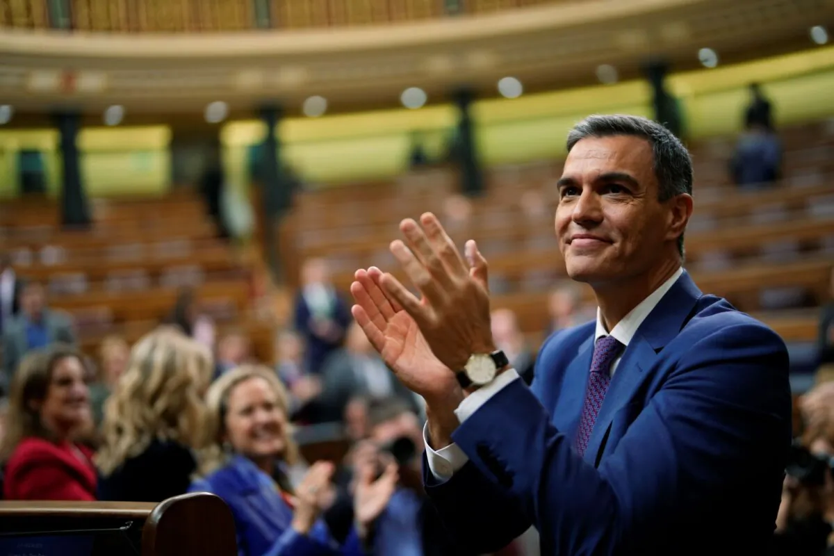 Spain's acting Prime Minister Pedro Sanchez applauds he was chosen by a majority of legislators to form a new government after a parliamentary vote at the Spanish Parliament in Madrid, Spain, on Nov. 16, 2023. (Manu Fernandez/AP)