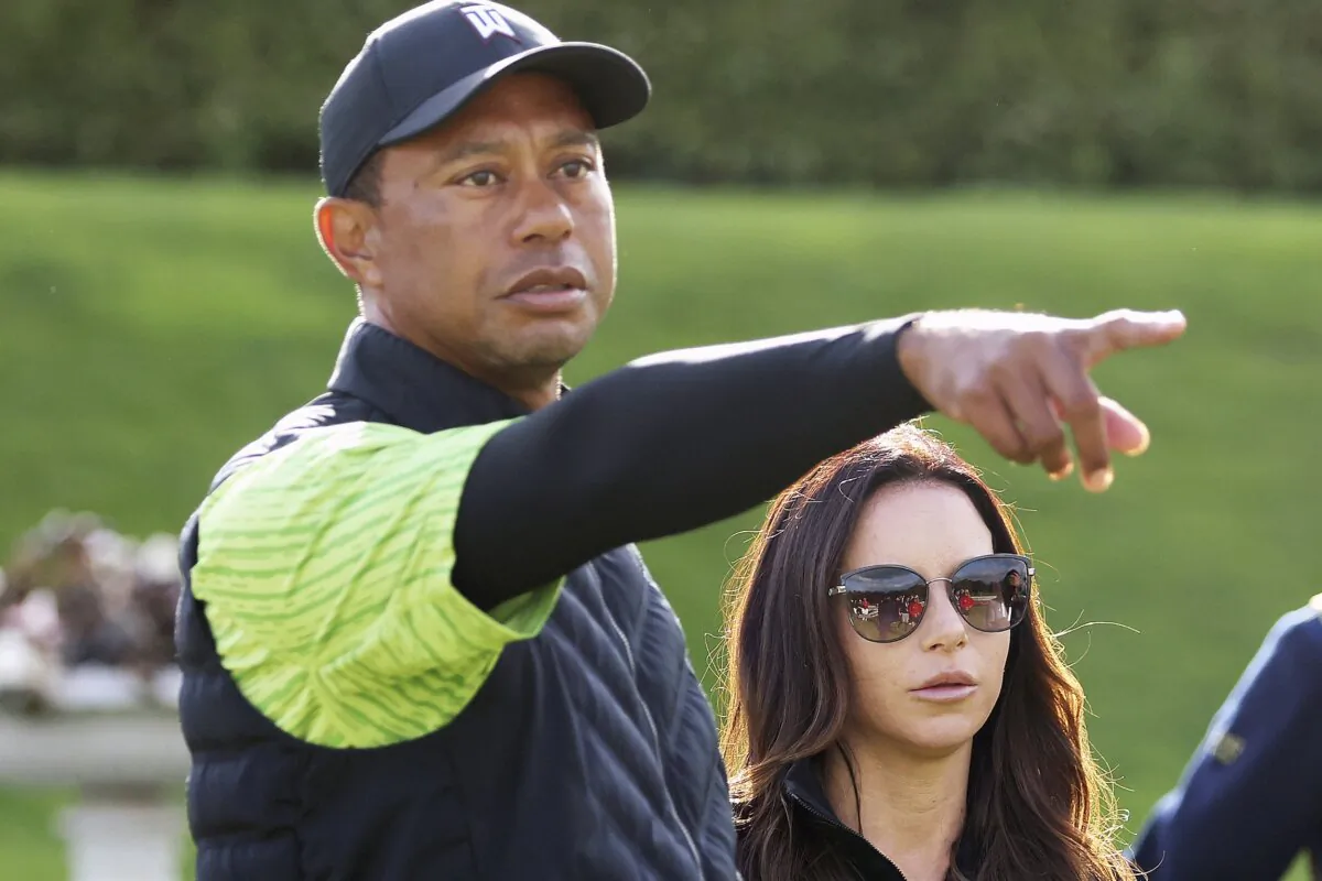 Tiger Woods (L) and Erica Herman appear on the 18th green during the JP McManus Pro-Am at Adare Manor, Limerick, Ireland, on July, 4, 2022. (Peter Morrison/AP Photo)