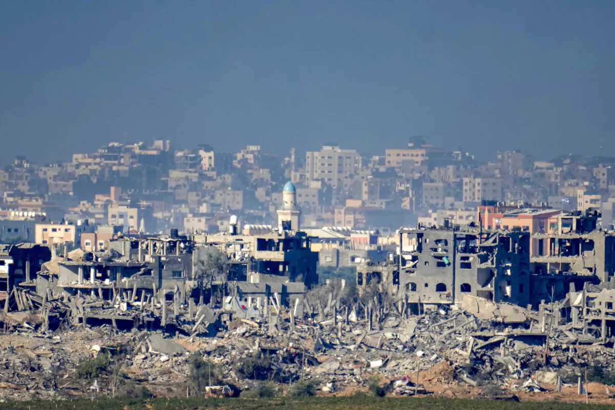 In this photograph taken near the Israeli border with the Gaza Strip, destroyed buildings of Beit Hanoun in Northern Gaza are seen from Sedorot, Israel, on Nov. 16, 2023. (Christopher Furlong/Getty Images)