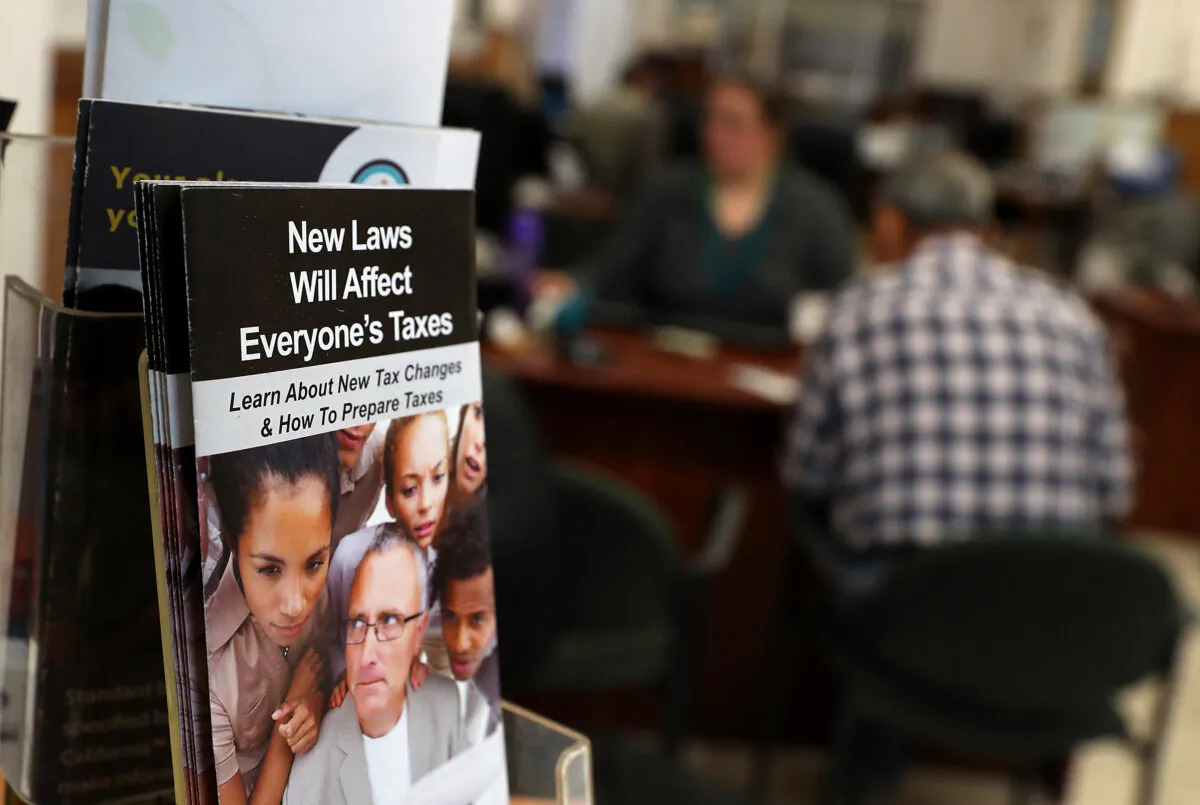 A pamphlet about new tax laws is displayed at Liberty Tax Service tax in Oakland, Calif., on April 16, 2018. (Justin Sullivan/Getty Images)