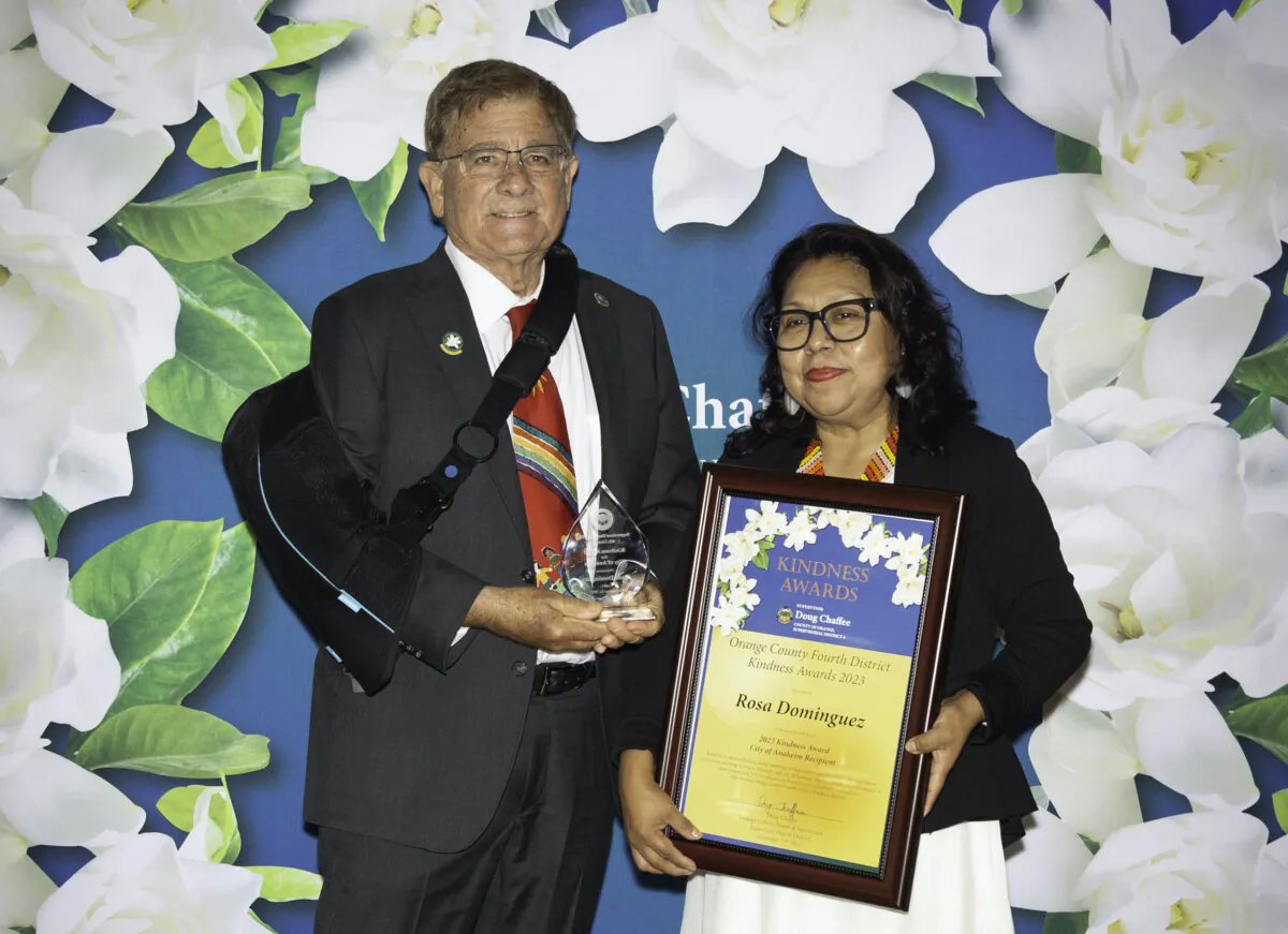 Rosa Dominguez receives a Kindness Award from Orange County Supervisor Doug Chaffee in Buena Park, Calif., on Nov. 13, 2023. (Courtesy of Donna Edman Photography)