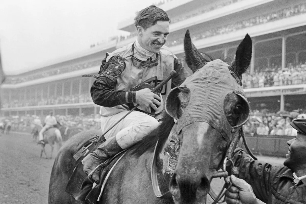 Jockey Bob Ussery sits atop Proud Clarion as they entered the winners circle after winning the Kentucky Derby horse race in Louisville on May 6, 1967. (AP Photo)