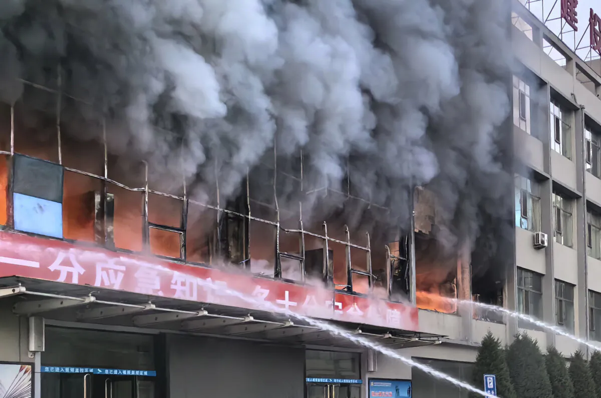 A fire at a building of the the Yongju Coal Company in Lyuliang city in northern China's Shanxi Province, on Nov. 16, 2023. (Xinhua via AP)