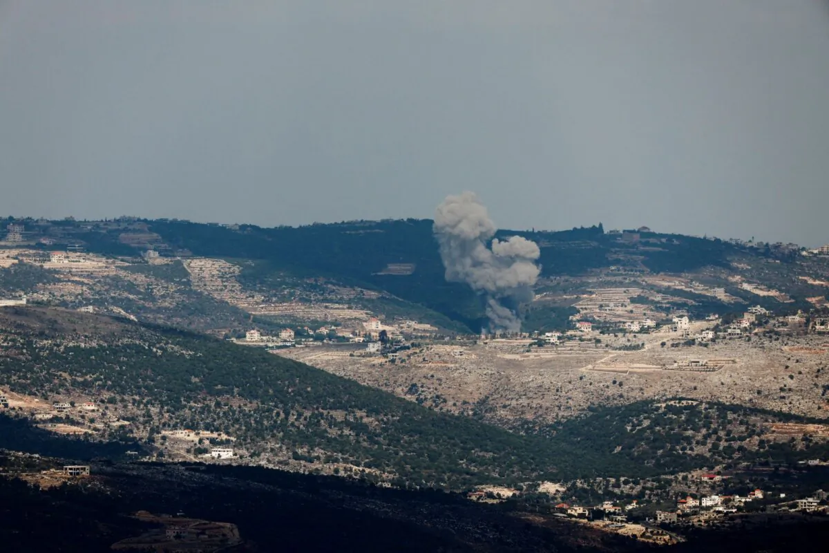 Smoke rises on the Lebanese side of the border between Israel and Lebanon after an Israeli airstrike, as seen from northern Israel, on Nov. 18, 2023. (Evelyn Hockstein/Reuters)