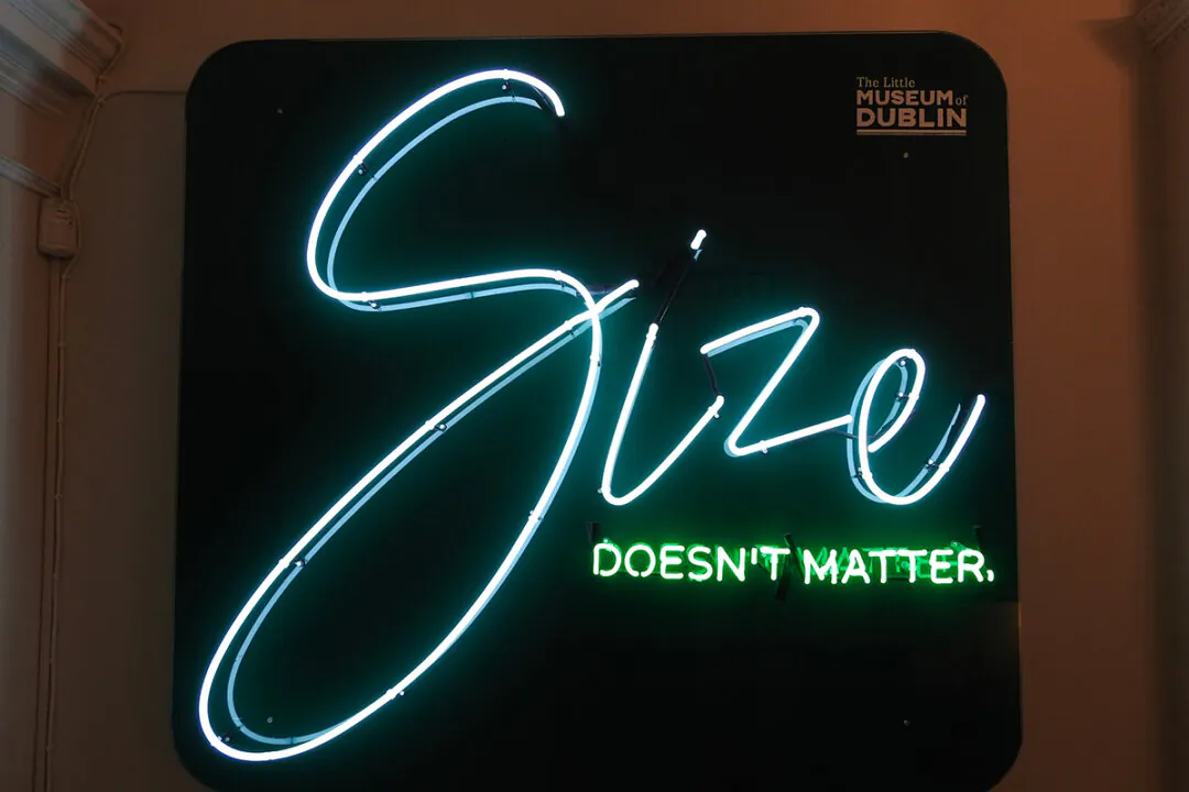 A neon sign that reads "Size doesn't matter" outside the entrance to The Little Museum of Dublin. (Derick P. Hudson/Shutterstock)