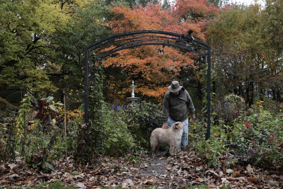Possibility Place Nursery's founder Connor Shaw walks around the property with his dog, Remy. Shaw is semiretired but still comes out to connect with their customers. (Antonio Perez/Chicago Tribune/TNS)
