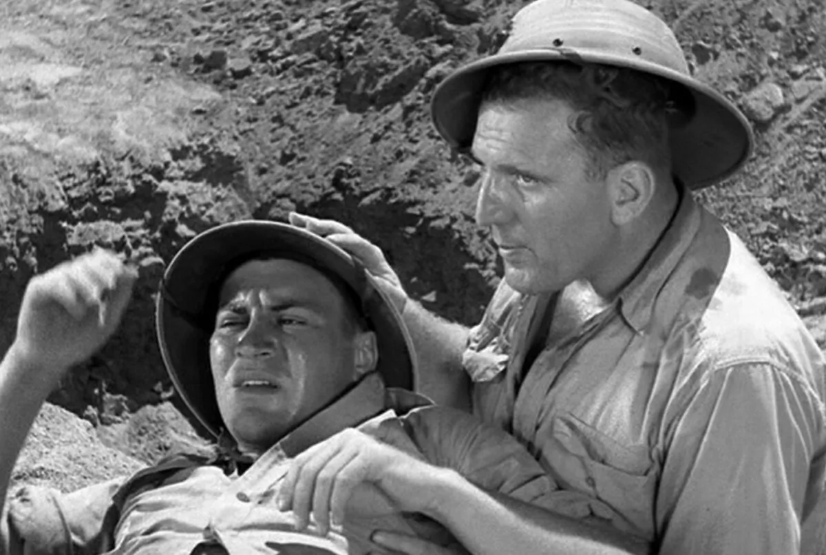 Brothers until the end: Privates Joe Doyle (Robert Preston, L) and Aloysius K. 'Smacksie' Randall (William Bendix), in “Wake Island.” (Paramount Pictures)