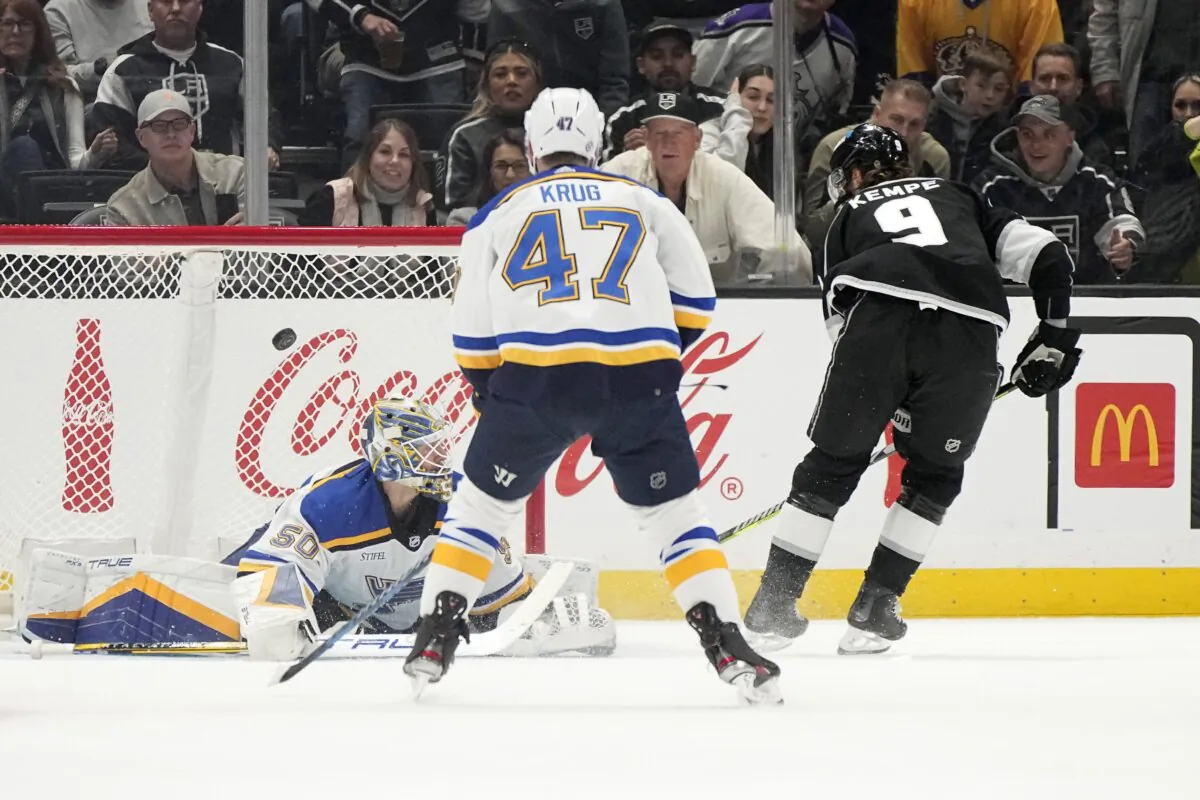 Los Angeles Kings center Adrian Kempe (R) scores on St. Louis Blues goaltender Jordan Binnington as defenseman Torey Krug watches during the first period of an NHL hockey game in Los Angeles on Nov. 18, 2023. (Mark J. Terrill/AP Photo)