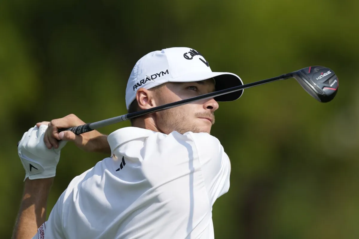 Nicolai Hojgaard of Denmark plays his second shot on the second hole hole during the final round of the DP World Tour Championship golf tournament in Dubai, United Arab Emirates, on Nov. 19, 2023. (Kamran Jebreili/AP Photo)