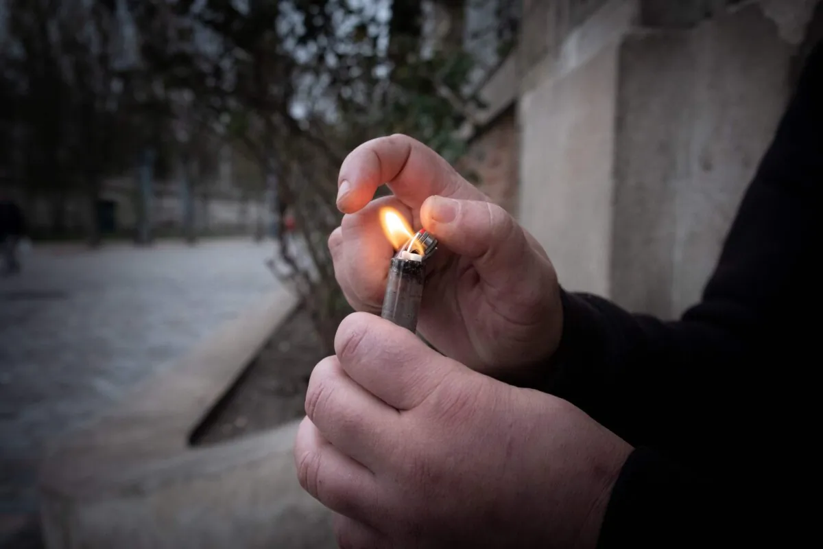A crack addict lights a pipe, in a file photo. (Joel Saget/AFP via Getty Images)