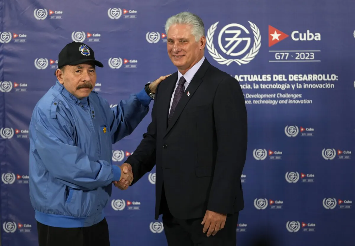 Cuban President Miguel Diaz-Canel, right, shakes hands with Nicaragua's President Daniel Ortega during a photo opportunity at the G77+China summit in Havana, Cuba, on Sept. 15, 2023. (Ramon Espinosa/AP Photo)