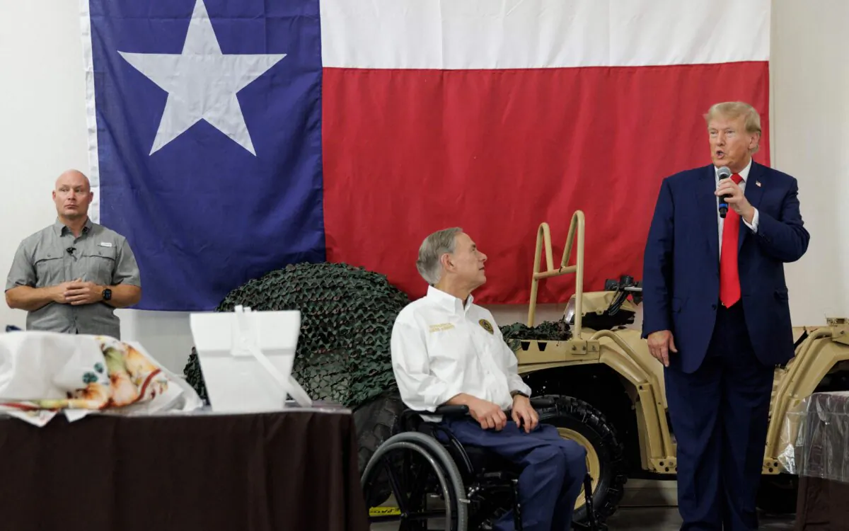 Former President Donald Trump (right) gives remarks with Texas Gov. Greg Abbott at the South Texas International airport in Edinburg, Texas, on Nov. 19, 2023. (Michael Gonzalez/AFP via Getty Images)