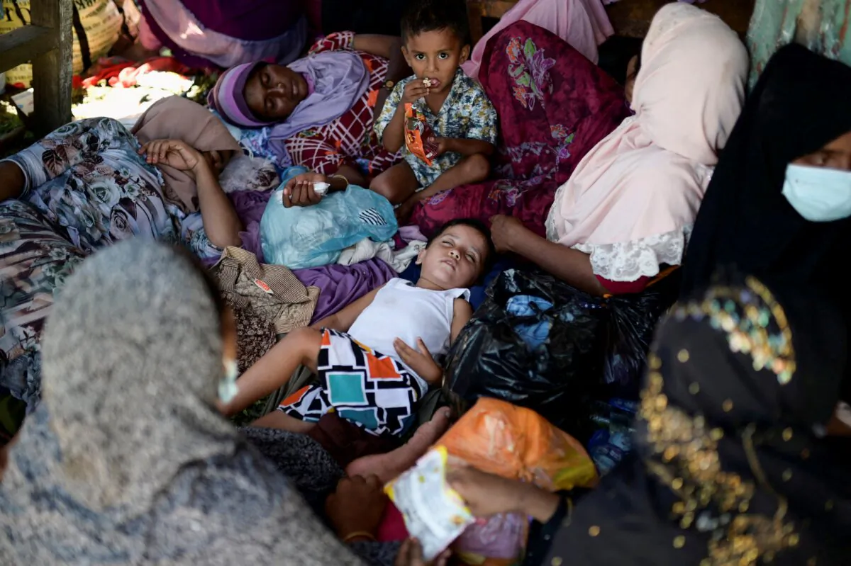 Rohingya Muslim women and children rest, following their arrival in Kulee village, Pidie regency, Aceh Province, Indonesia, on Nov. 19, 2023. (Riska Munawarah/Reuters)