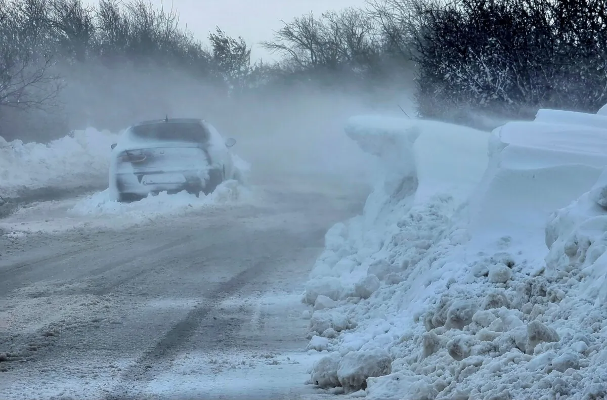 A car is left on the road near town of Dobrich, Bulgaria, on Nov. 19, 2023. (Bulgarian News Agency via AP)