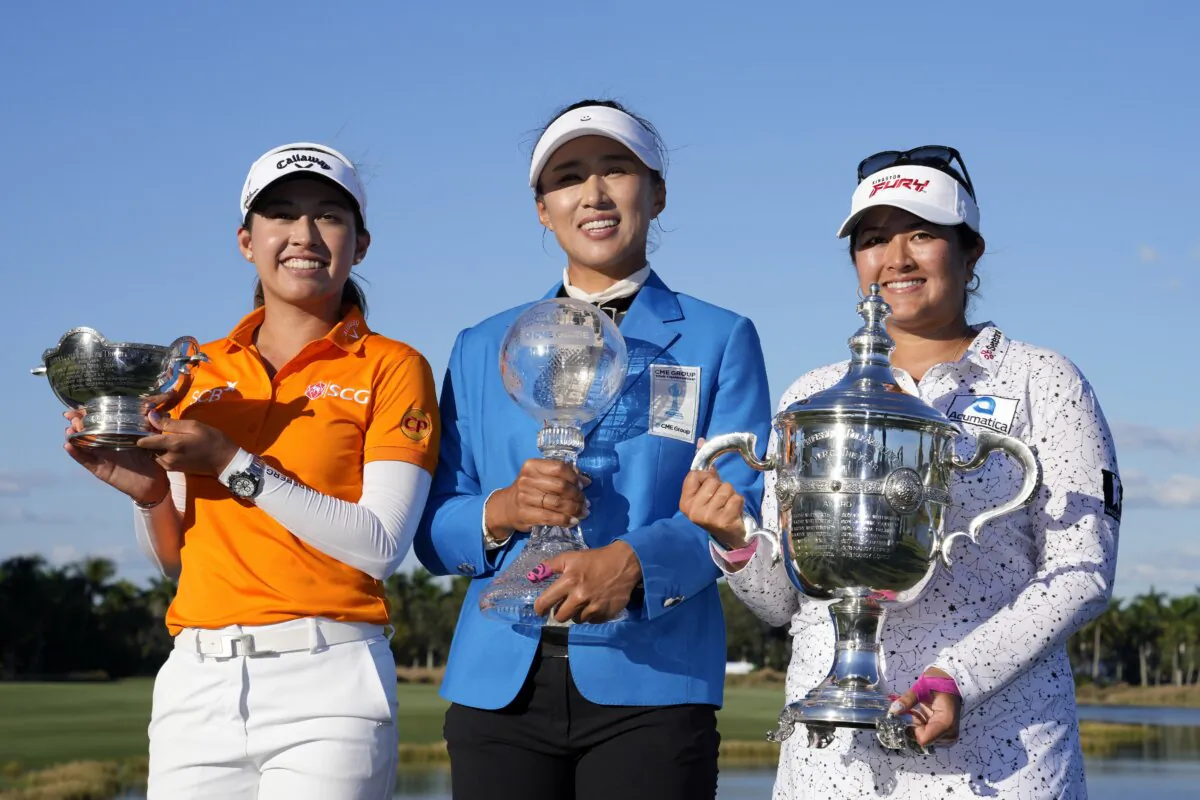 Vare trophy winner Atthaya Thitikul, of Thailand (L), Amy Yang, winner of the LPGA CME Group Tour Championship golf tournament (C) and Rolex Player of the Year Lilia Vu (R) pose with their trophies in Naples, Fla., on Nov. 19, 2023. (Lynne Sladky/AP Photo)