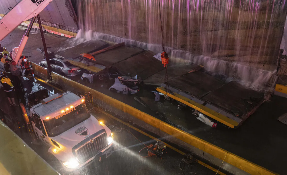 Rescue teams work at the place where a wall collapsed at the entrance of a tunnel in Santo Domingo, Dominican Republic, on Nov. 18, 2023. (Eddy Vittini/AP Photo)