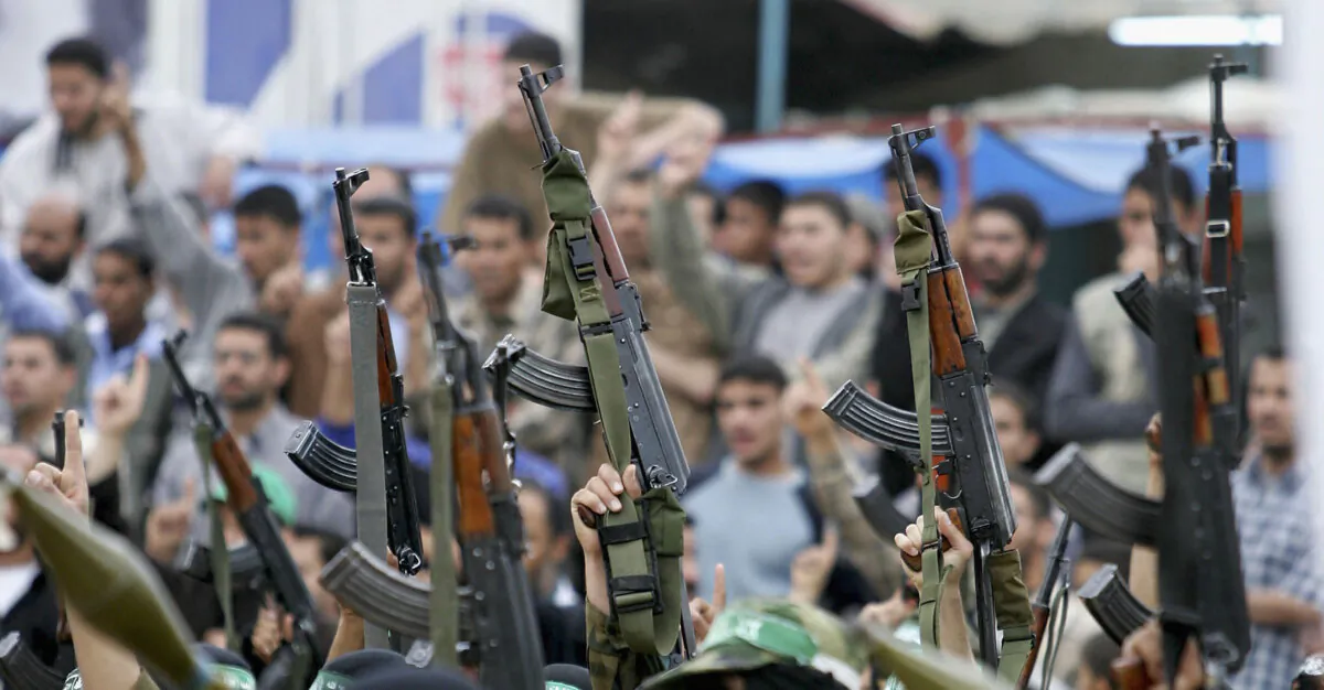 Masked Hamas members march during a rally on April 19, 2005, in the Rafah refugee camp, southern Gaza Strip, ahead of the 2006 election. (Abid Katib/Getty Images)