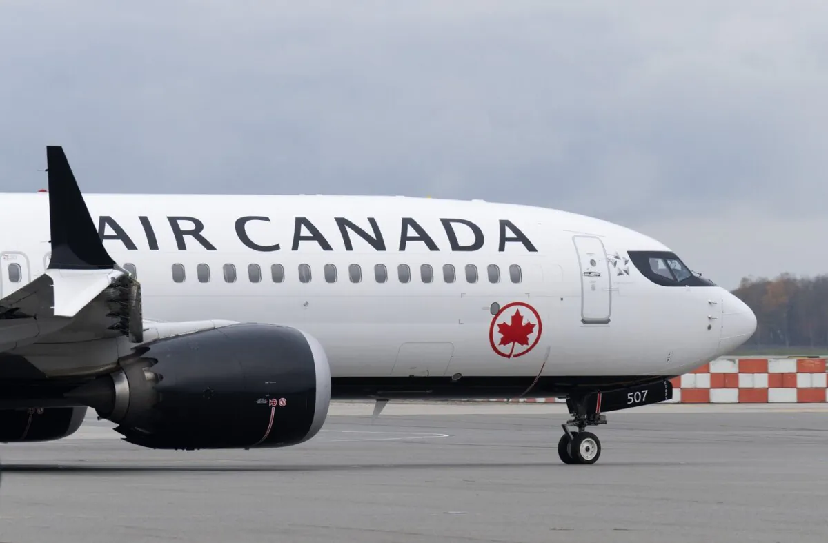 An Air Canada jet taxis at the airport in Vancouver on Nov. 15, 2023. (The Canadian Press/Adrian Wyld)