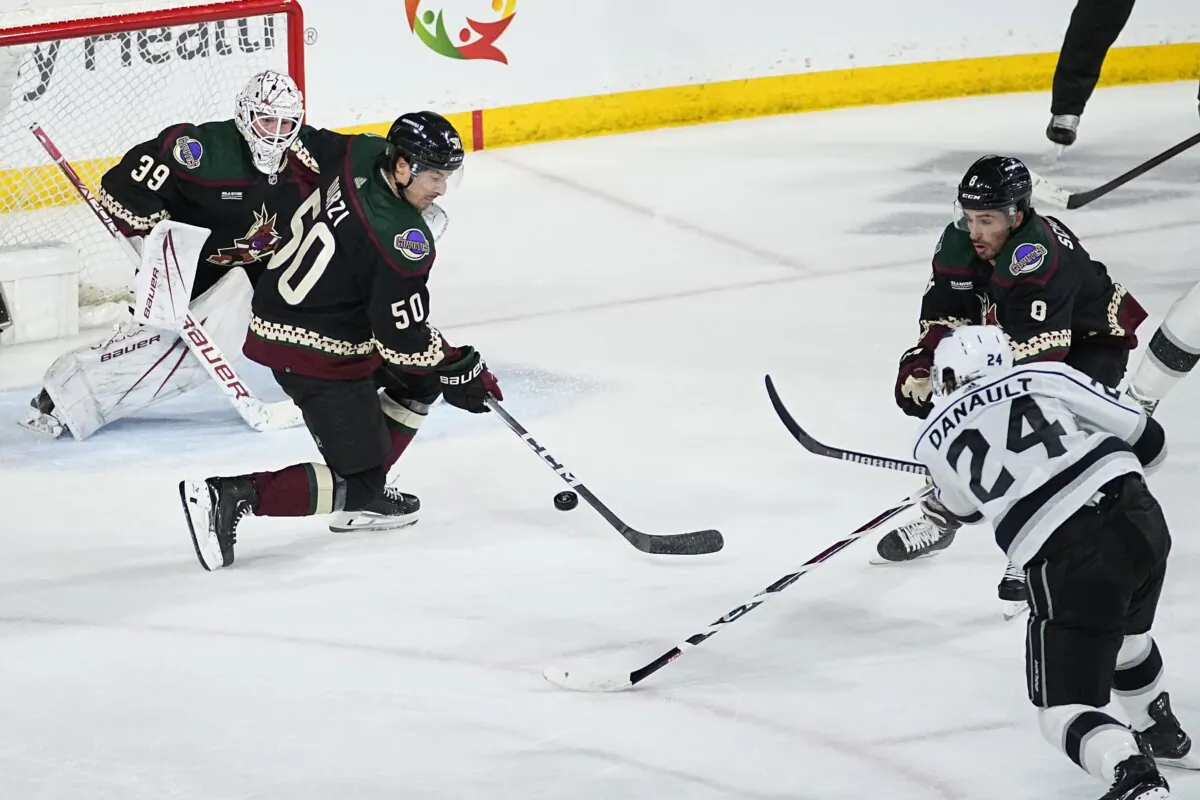 Los Angeles Kings center Phillip Danault (24) scores a goal on Arizona Coyotes goaltender Connor Ingram (39) during the third period of an NHL hockey game in Tempe, Ariz., on Nov. 20, 2023. (Matt York/AP Photo)