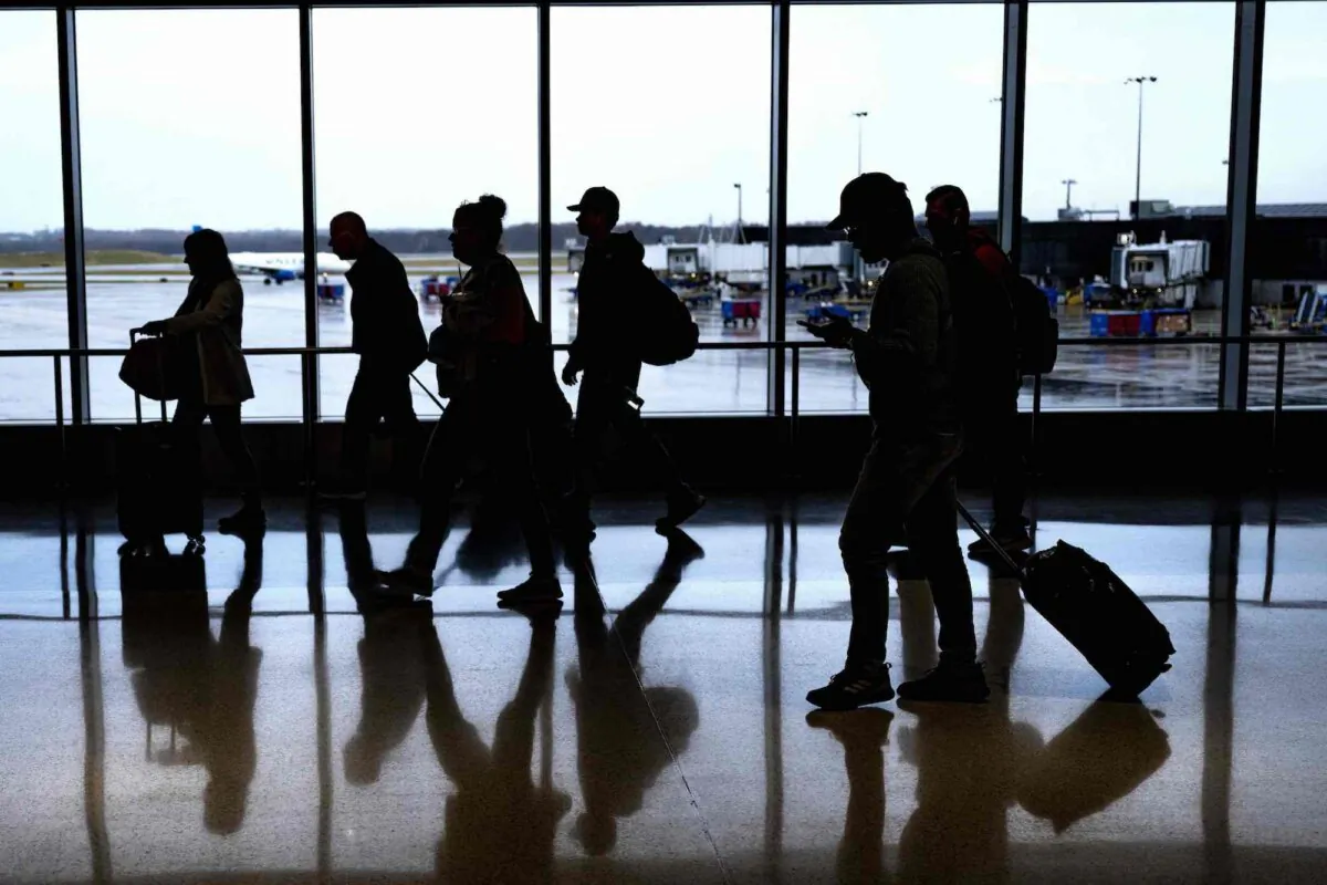 Passengers walk through the terminal at Baltimore/Washington International Thurgood Marshall Airport in Linthicum, Md., on Nov. 21, 2023, (Jim Watson/AFP via Getty Images)