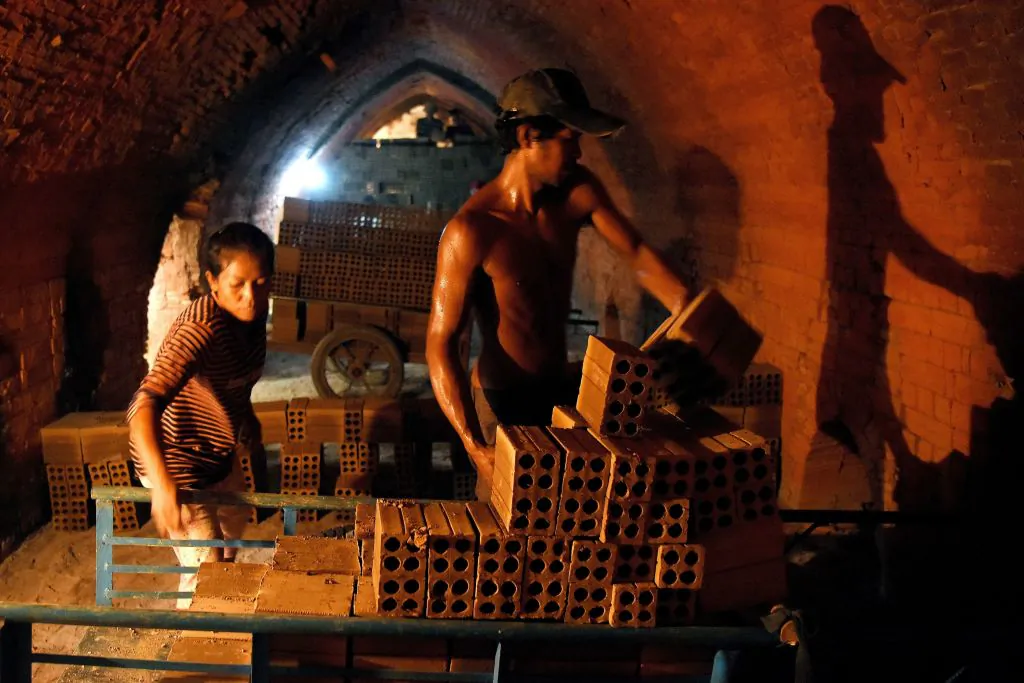 Cambodian laborers working at a brick factory on the outskirts of Phnom Penh, on Dec. 11, 2018. (Tang Chhin Sothy/AFP via Getty Images)