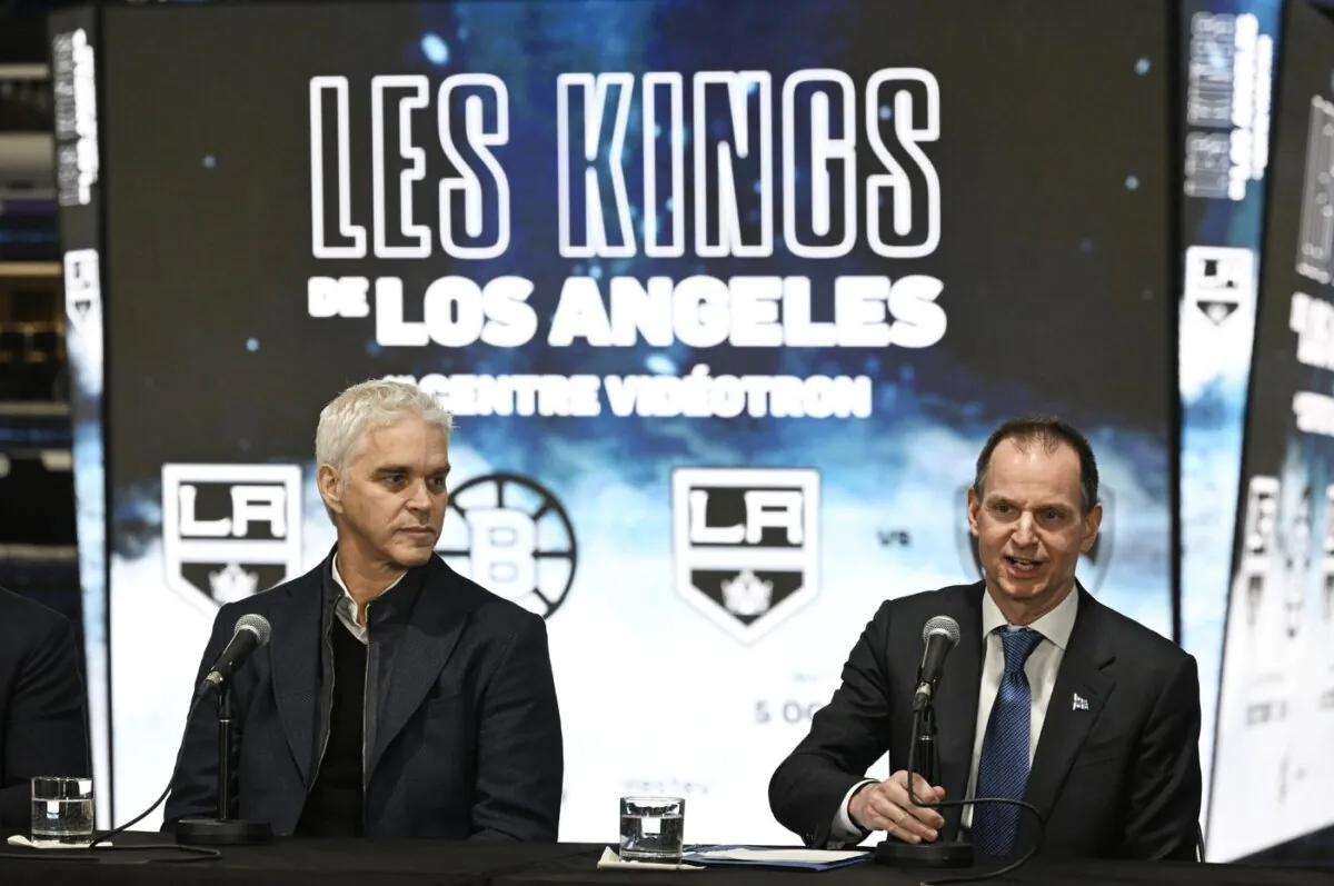 Finance Minister Eric Girard (R) speaks at a news conference as Luc Robitaille, president of the Los Angeles Kings looks on, in Quebec City, on Nov. 14, 2023. (The Canadian Press/Jacques Boissinot)