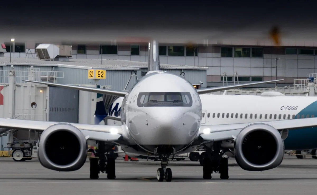 An Air Canada jet taxis at the airport in Vancouver, B.C., on Nov. 15, 2023. (The Canadian Press/Adrian Wyld)