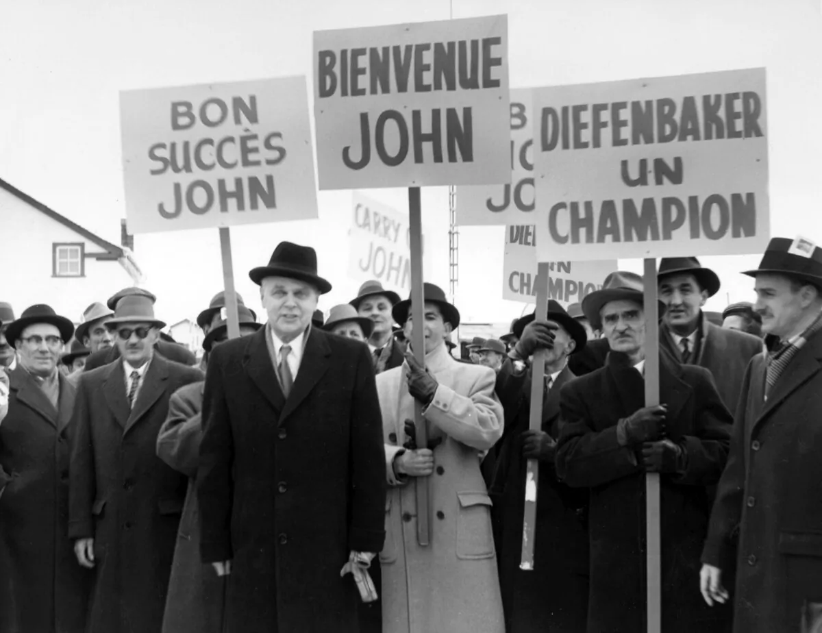 Prime Minister John Diefenbaker is greeted by supporters in Bagotville, Que., in 1958. (The Canadian Press)