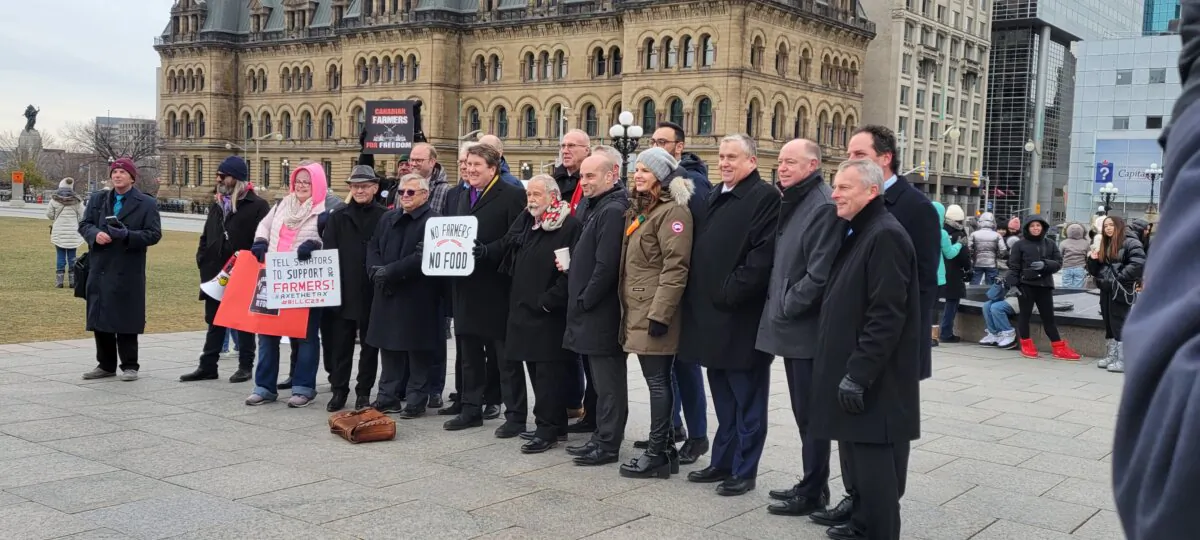 Conservative MPs and senators gather alongside farmers on Parliament Hill on Nov. 21, 2023. (Matthew Horwood/The Epoch Times)