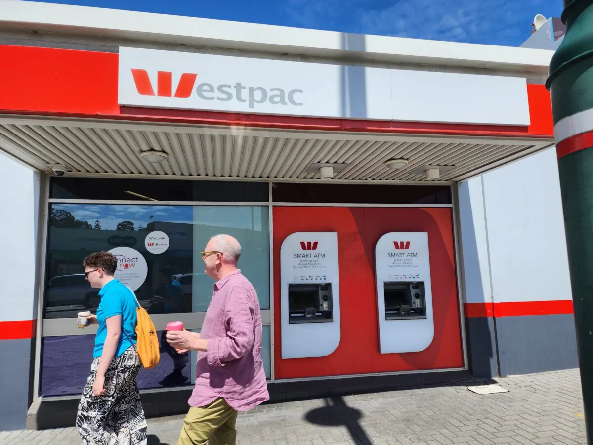 People walk past ATMs at a regional branch of Westpac bank in Albany, Western Australia, on Nov. 22, 2023. (Susan Mortimer/The Epoch Times)