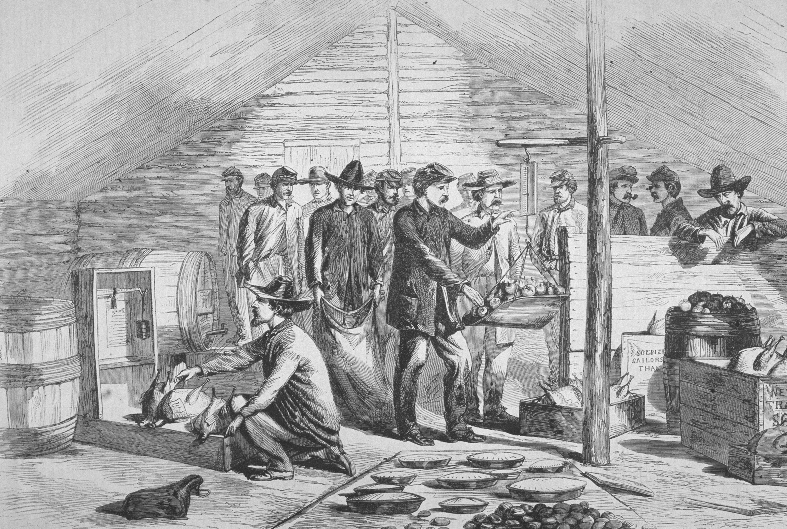 An engraving of Union troops of 5th and 9th Corps receiving thanksgiving rations during the US civil war, circa 1864. (Kean Collection/Archive Photos/Getty Images)