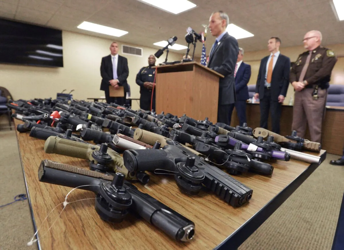 U.S. Attorney for the Western District of Michigan Mark Totten talks about the than 100 recovered stolen handguns that were stolen during a press conference in Benton Township, Mich., on Nov. 21, 2023. (Don Campbell/The Herald-Palladium via AP)