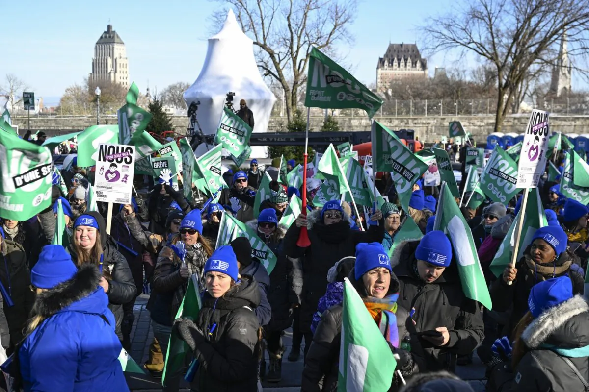 A few hundred demonstrators gather in front of the legislature, on the first of a three-day general strike in Quebec City, on Nov. 21, 2023. (The Canadian Press/Jacques Boissinot)
