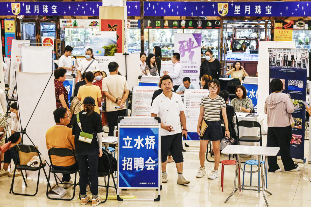 People attend a job fair in Beijing, on Aug. 19, 2023. (Jade Gao/AFP via Getty Images)